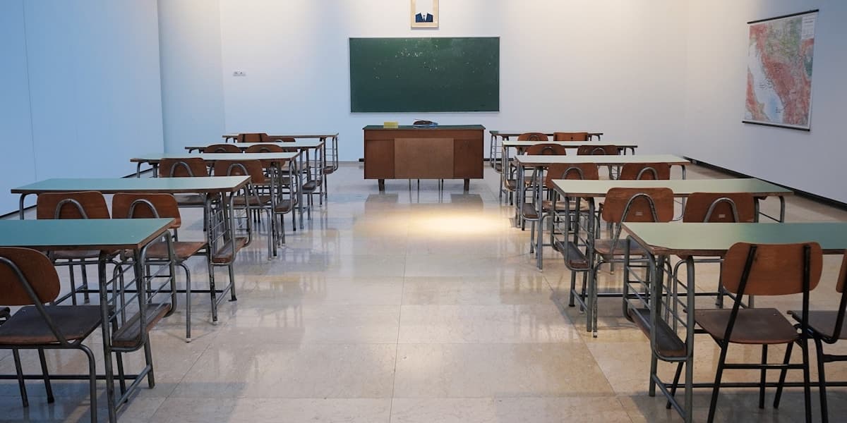 Empty classroom with rows of desks